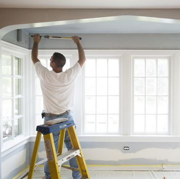 Contractor Painting a Room in HOuse