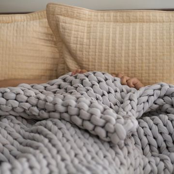 sleeping under weighted blanket